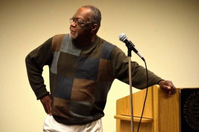 a man on a stage with a microphone